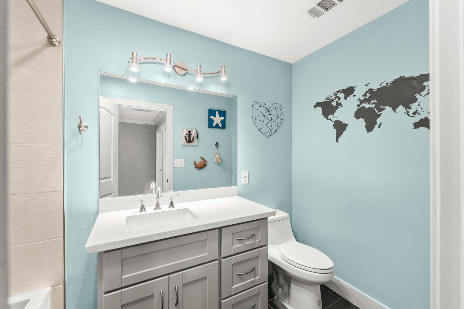 10835 Coloma Road, Unit 3 Rancho Cordova, CA 95670 - Photo 3 of 31 a bathroom with a sink mirror and toilet