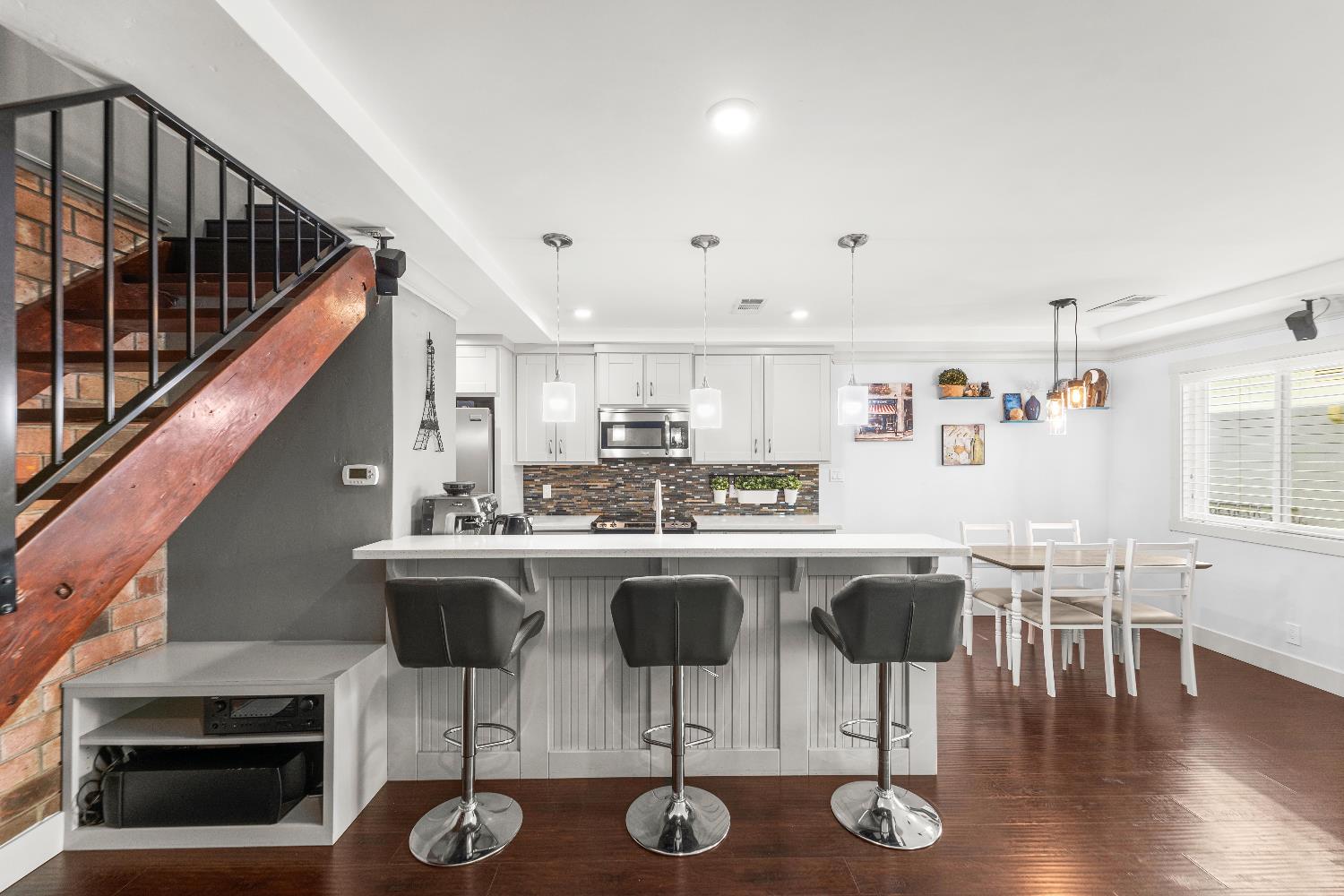 10835 Coloma Road, Unit 3 Rancho Cordova, CA 95670 - Photo 9 of 31 a kitchen with stainless steel appliances granite countertop a dining table chairs and granite counter tops