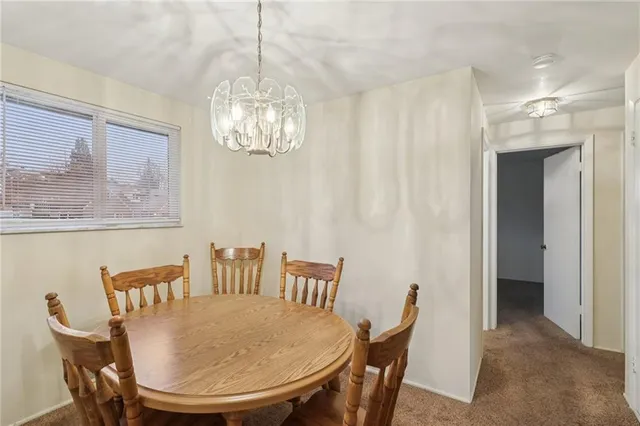 a bedroom with a bed and a chair