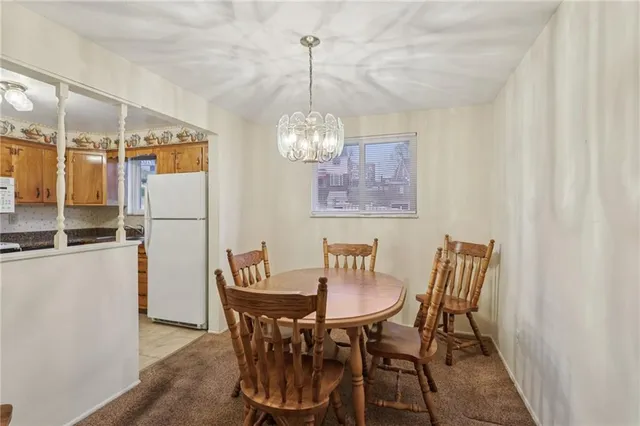 a kitchen with stainless steel appliances a stove a sink and a refrigerator