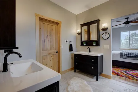 a bathroom with a sink double vanity and a mirror
