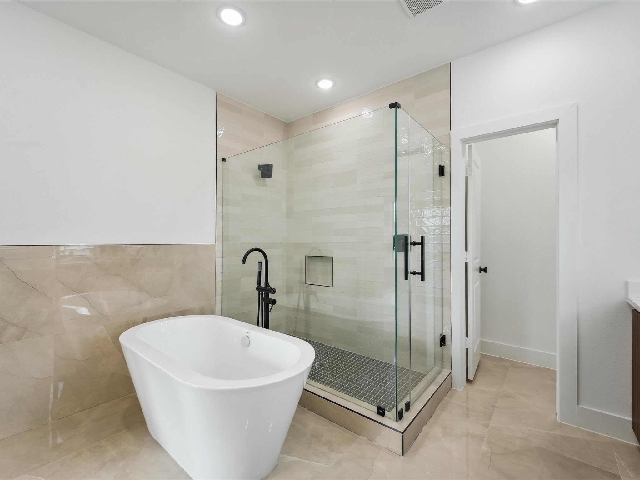 7416 Maxroy Street Houston, TX 77088 - Photo 22 of 41 a white bath tub sitting next to a bathroom