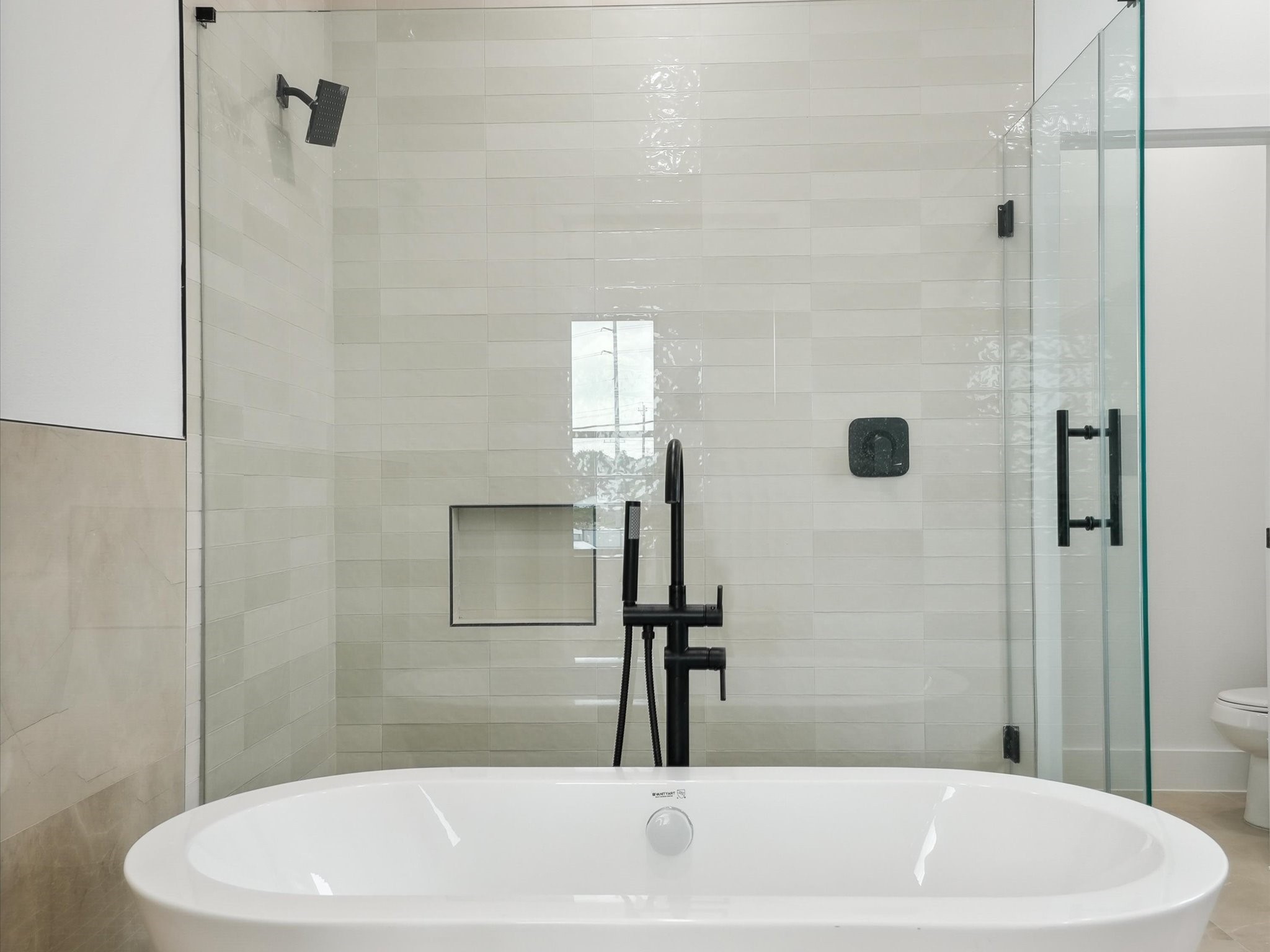 7416 Maxroy Street Houston, TX 77088 - Photo 23 of 41 a bathroom with a white bath tub