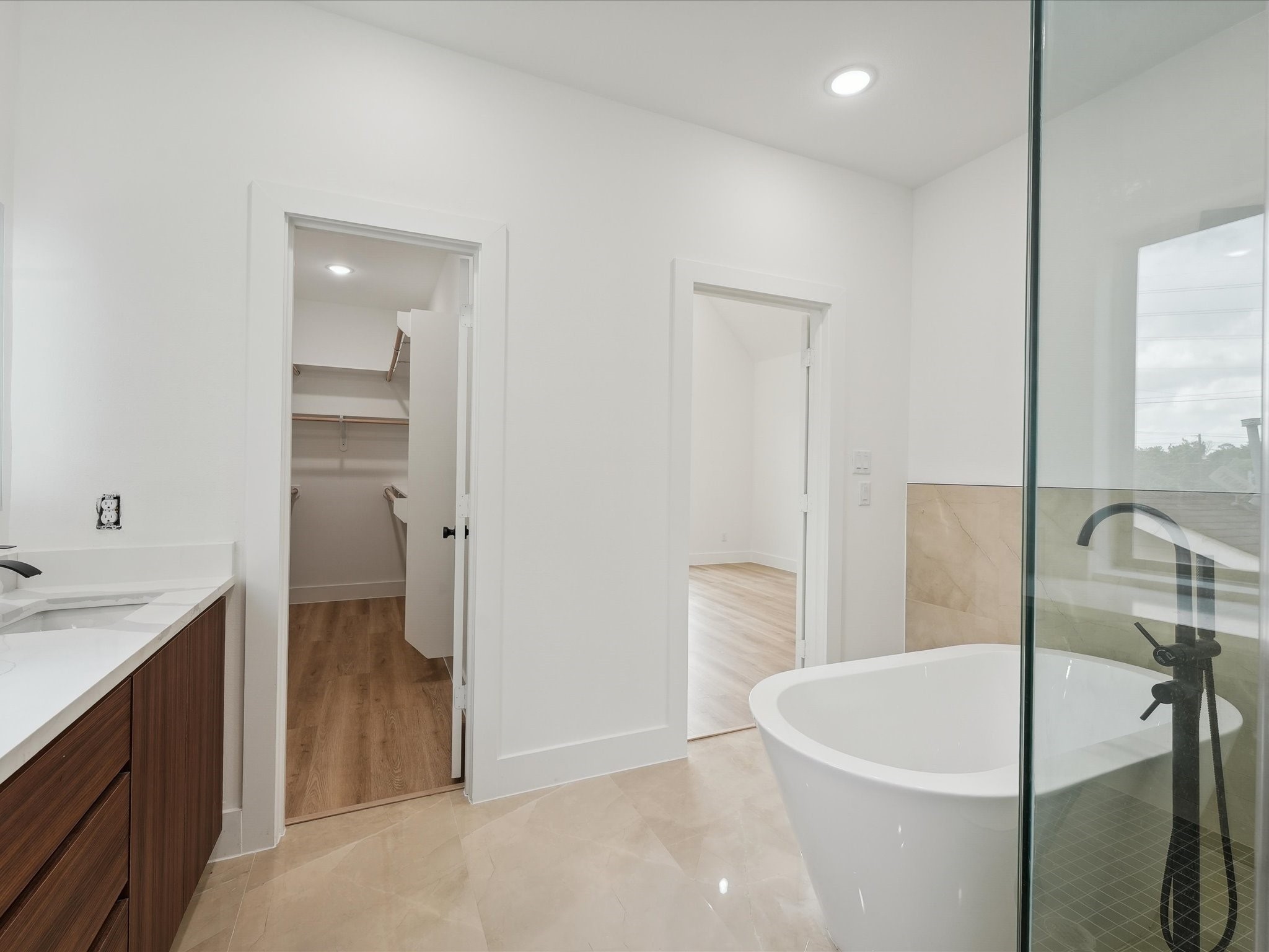 7416 Maxroy Street Houston, TX 77088 - Photo 24 of 41 a bathroom with a bathtub and a sink