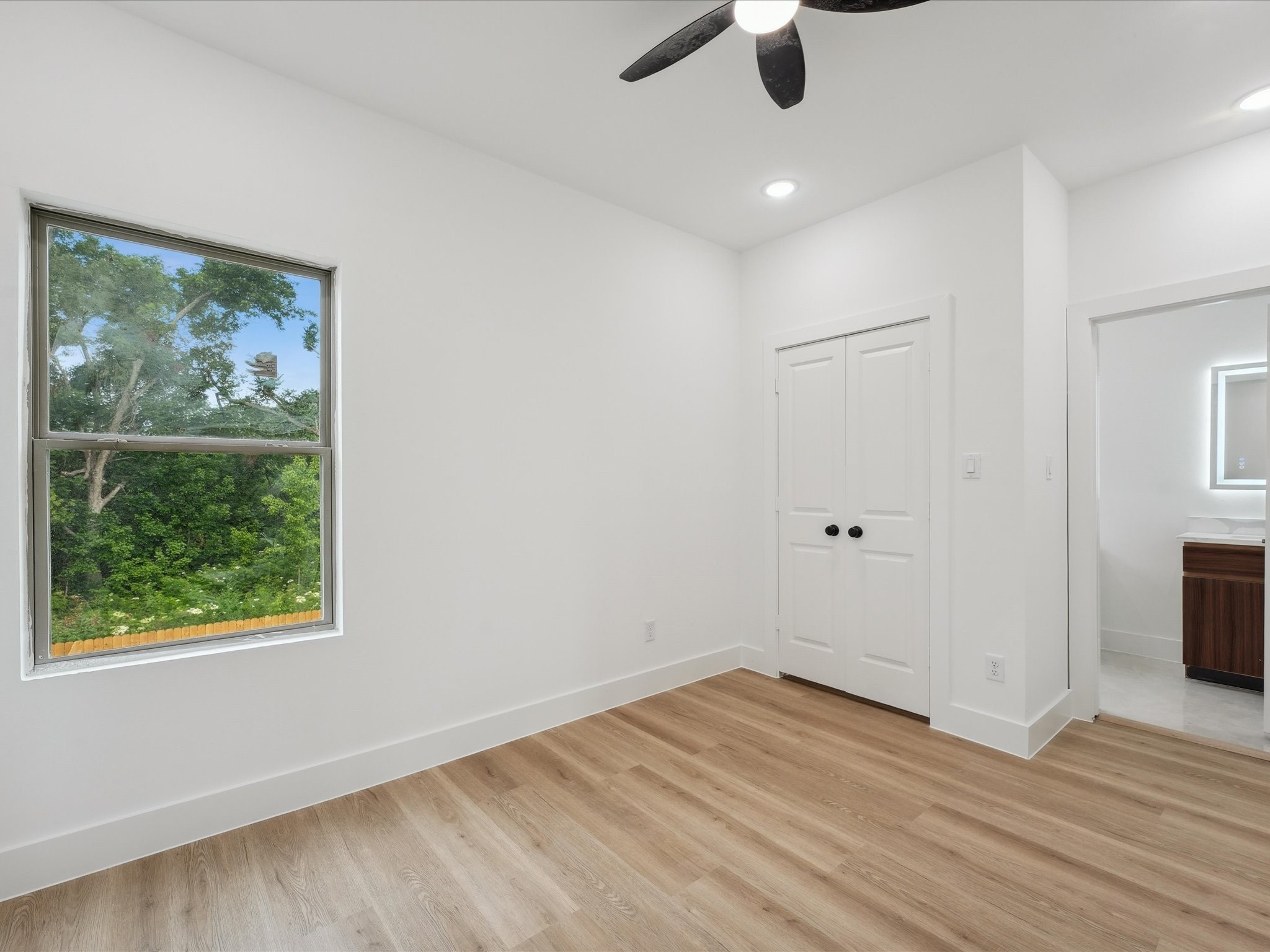 7416 Maxroy Street Houston, TX 77088 - Photo 33 of 41 wooden floor in an empty room with a window