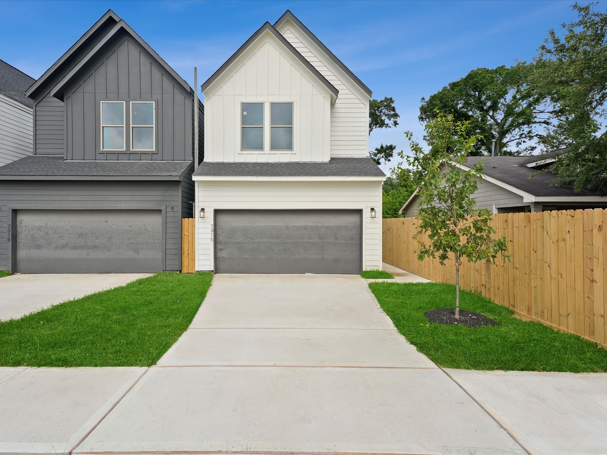 7416 Maxroy Street Houston, TX 77088 - Photo 38 of 41 a front view of a house with a yard and garage