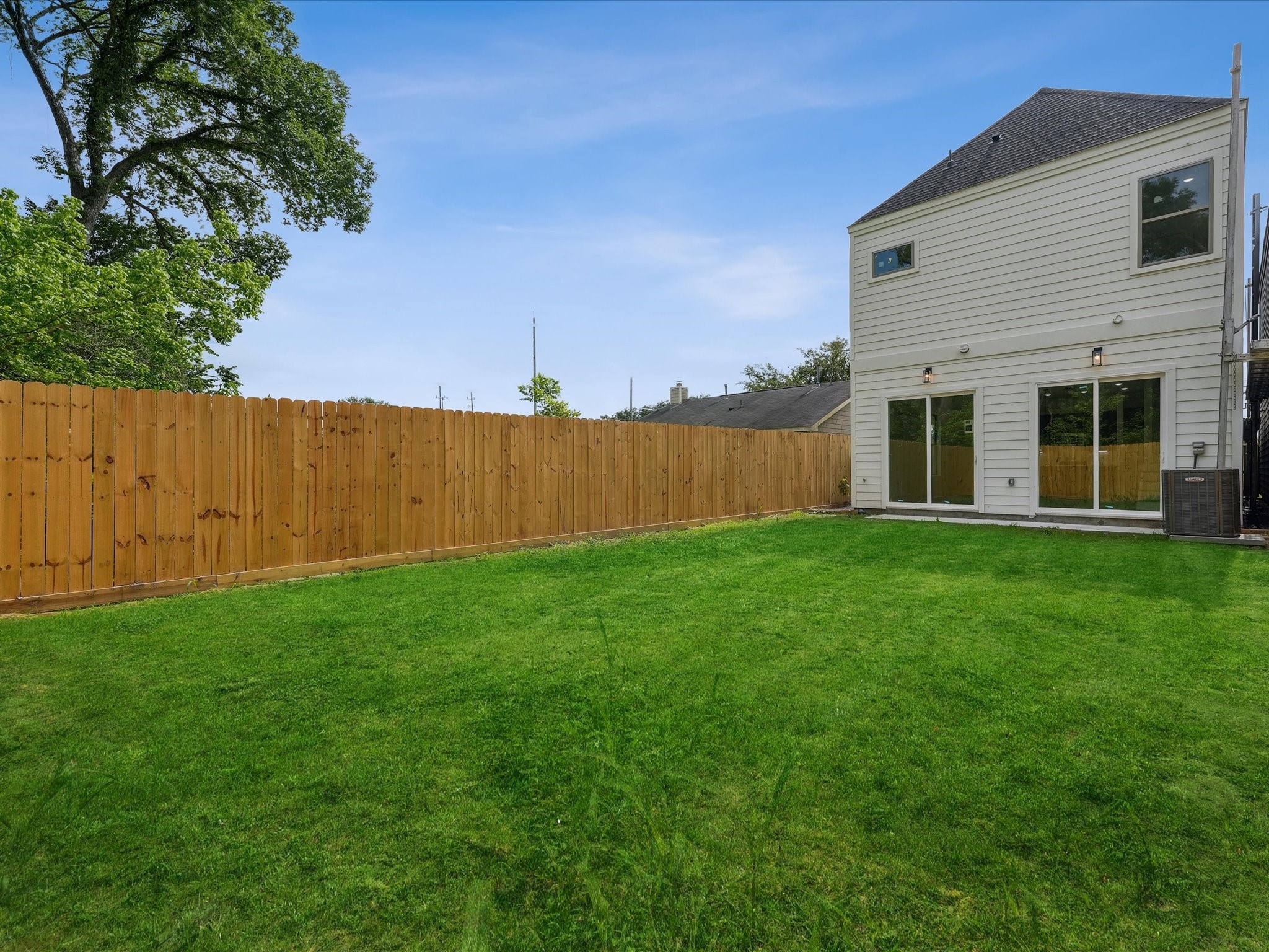 7416 Maxroy Street Houston, TX 77088 - Photo 39 of 41 a view of a backyard with plants and large tree