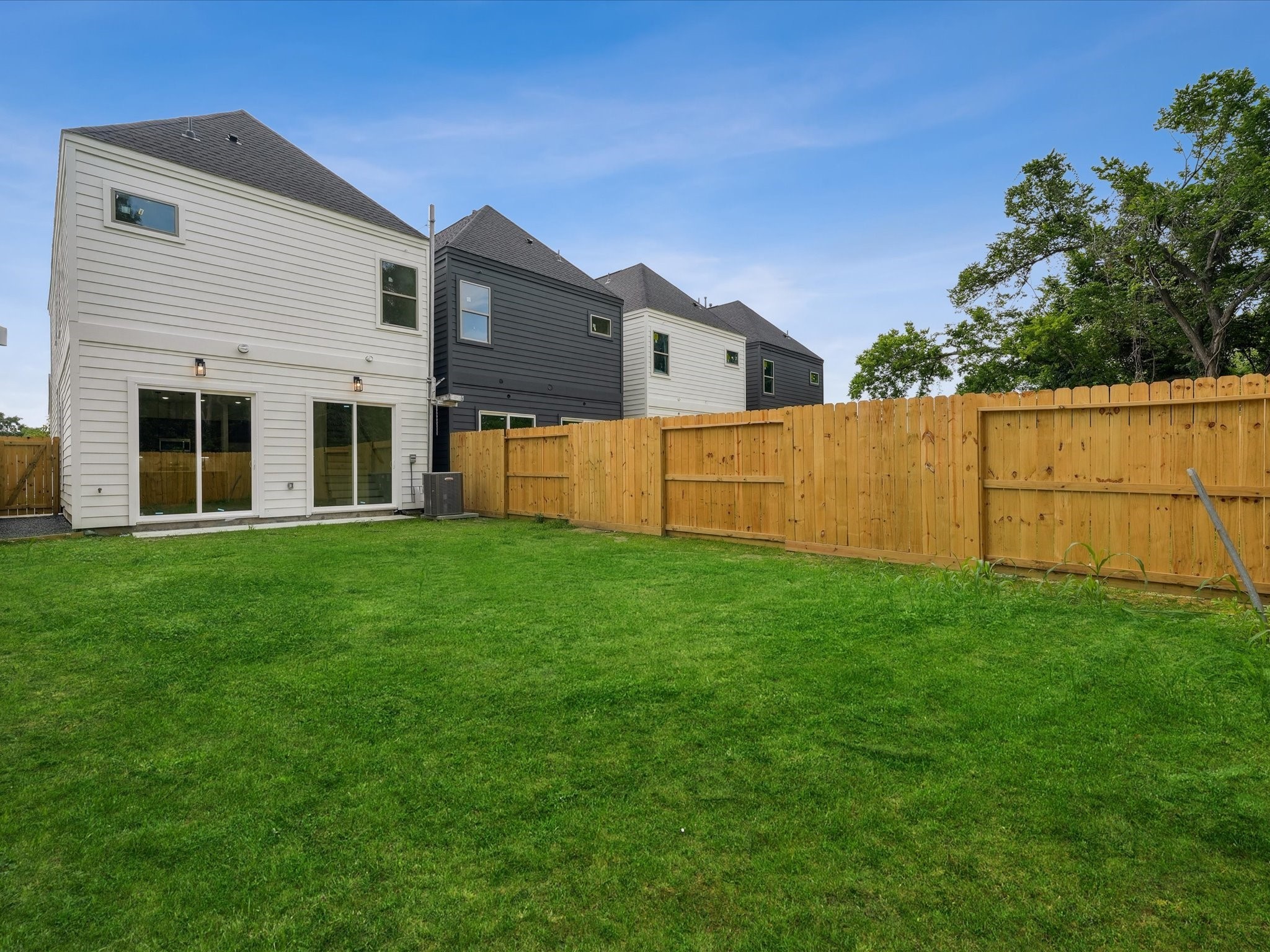 7416 Maxroy Street Houston, TX 77088 - Photo 4 of 41 a view of a house with backyard and garden