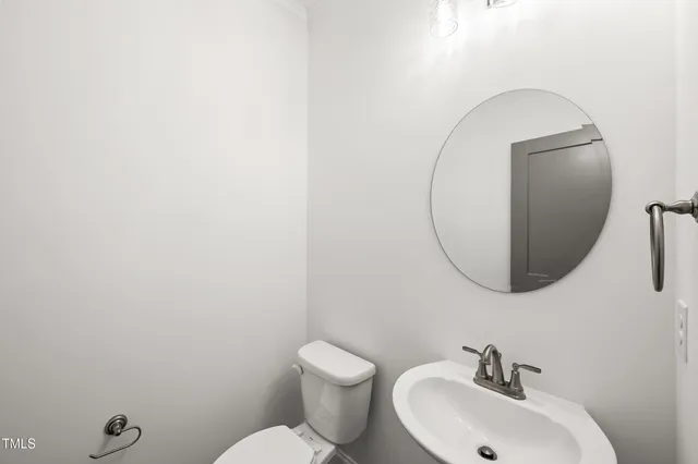 a view of room with window and wooden floor