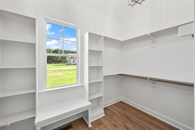 a bathroom with a sink toilet vanity and shower