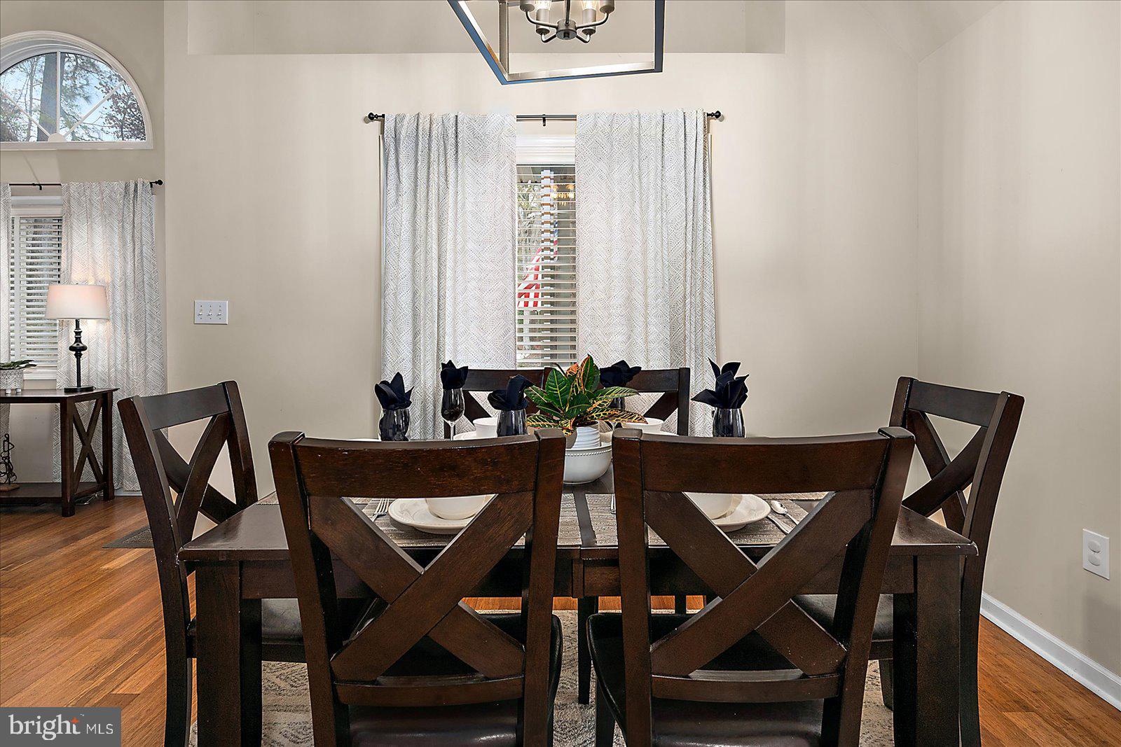 74 Robin Hood Trail Ocean Pines, MD 21811 - Photo 11 of 59 a view of a dining room with furniture and wooden floor