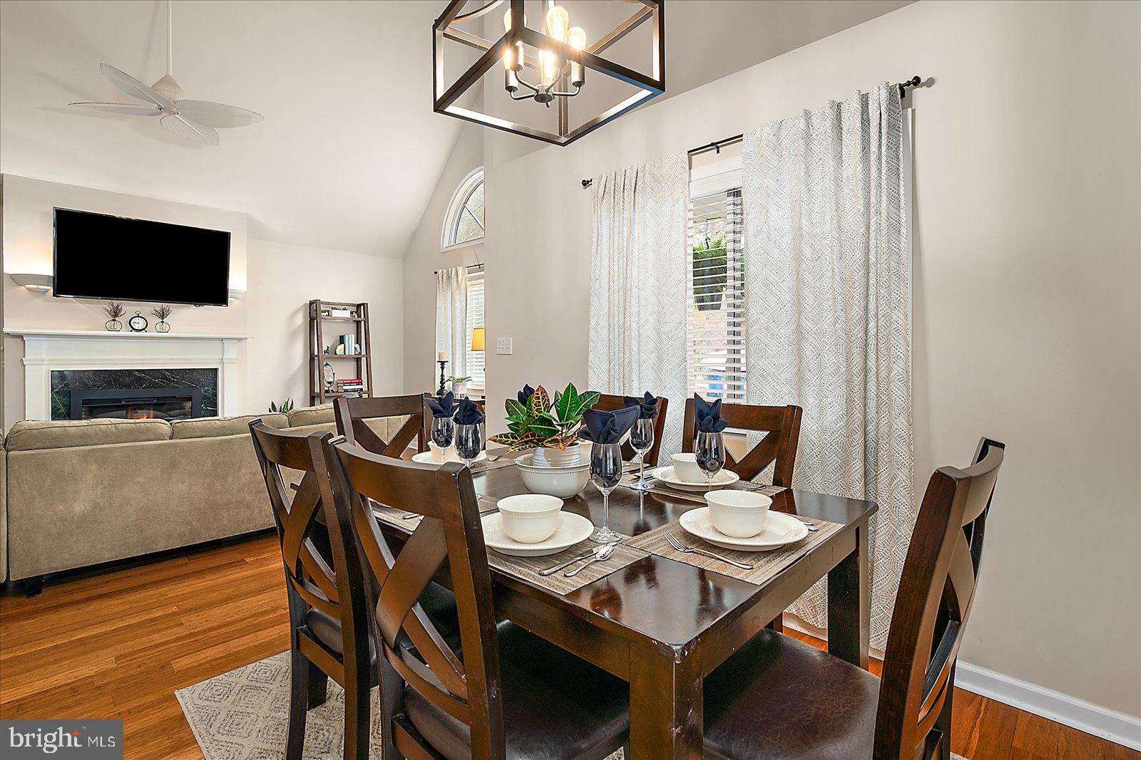 74 Robin Hood Trail Ocean Pines, MD 21811 - Photo 12 of 59 a view of a dining room with furniture wooden floor and a chandelier