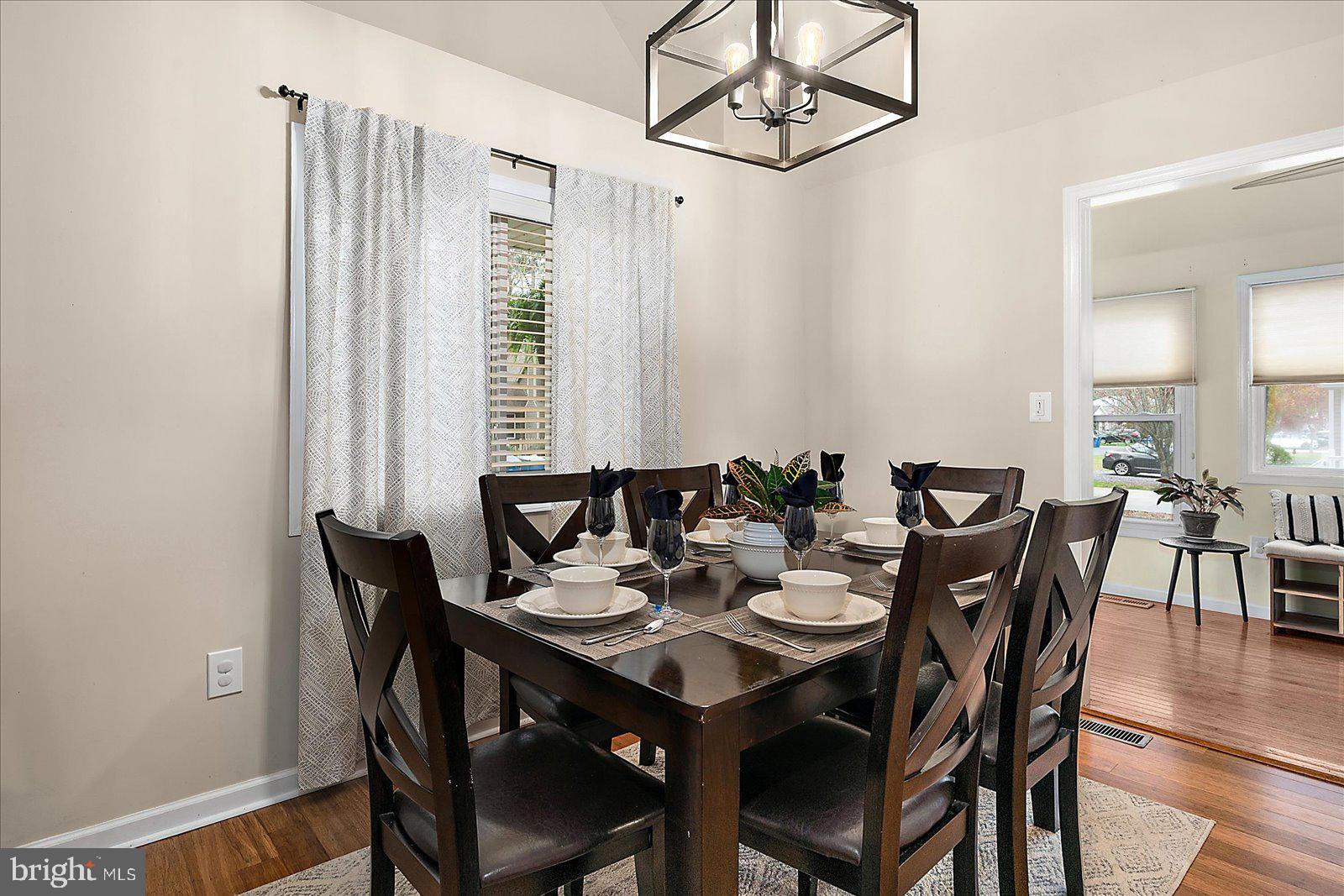 74 Robin Hood Trail Ocean Pines, MD 21811 - Photo 13 of 59 a view of a dining room with furniture and wooden floor