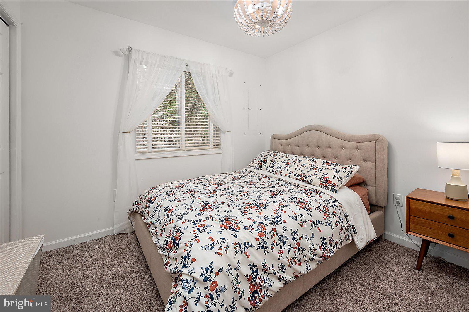 74 Robin Hood Trail Ocean Pines, MD 21811 - Photo 24 of 59 a bedroom with a bed and a window