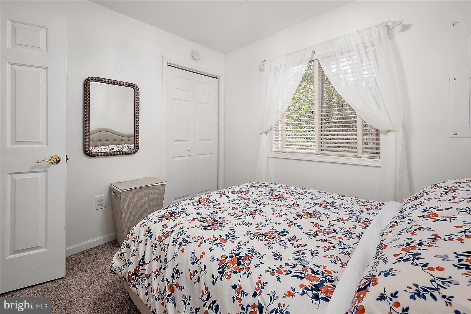 74 Robin Hood Trail Ocean Pines, MD 21811 - Photo 25 of 59 a bedroom with a bed and a dresser