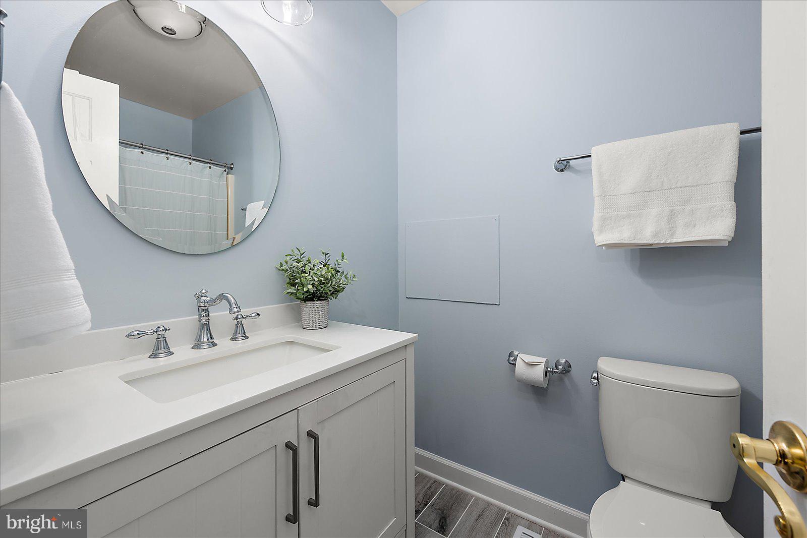 74 Robin Hood Trail Ocean Pines, MD 21811 - Photo 27 of 59 a bathroom with a toilet sink and mirror