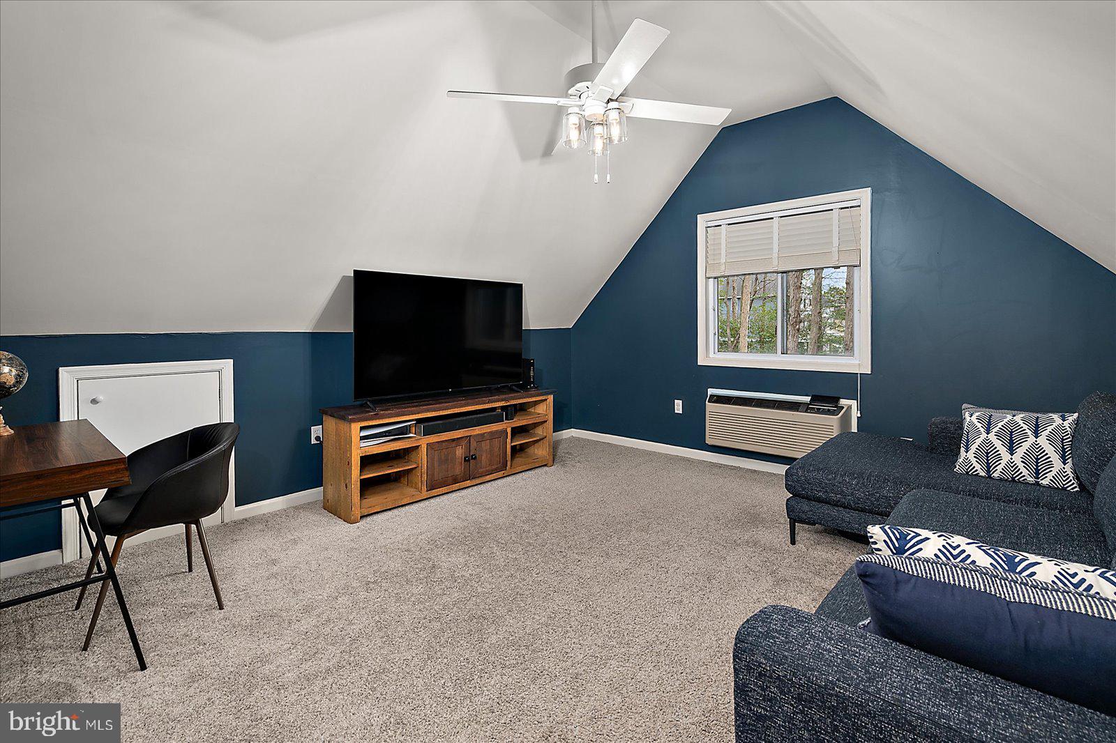 74 Robin Hood Trail Ocean Pines, MD 21811 - Photo 31 of 59 a living room with furniture and a flat screen tv