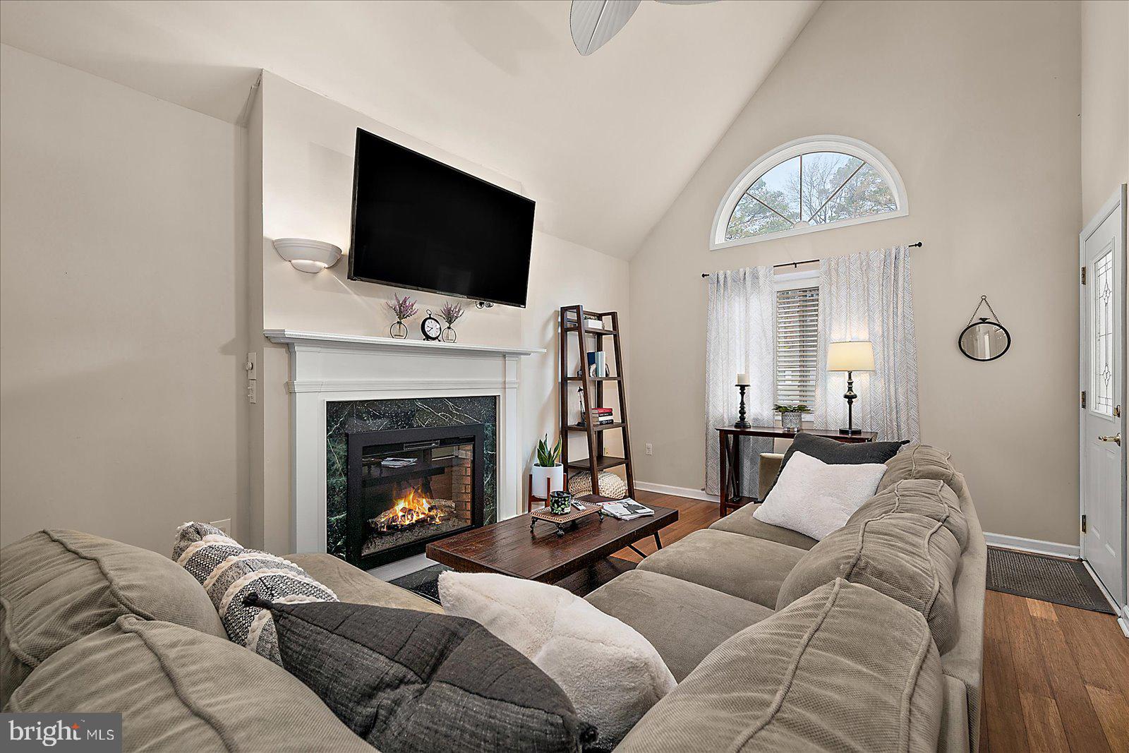 74 Robin Hood Trail Ocean Pines, MD 21811 - Photo 4 of 59 a living room with furniture fireplace and flat screen tv