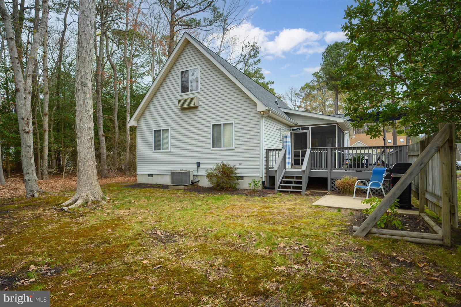 74 Robin Hood Trail Ocean Pines, MD 21811 - Photo 48 of 59 a view of a house with backyard porch and sitting area