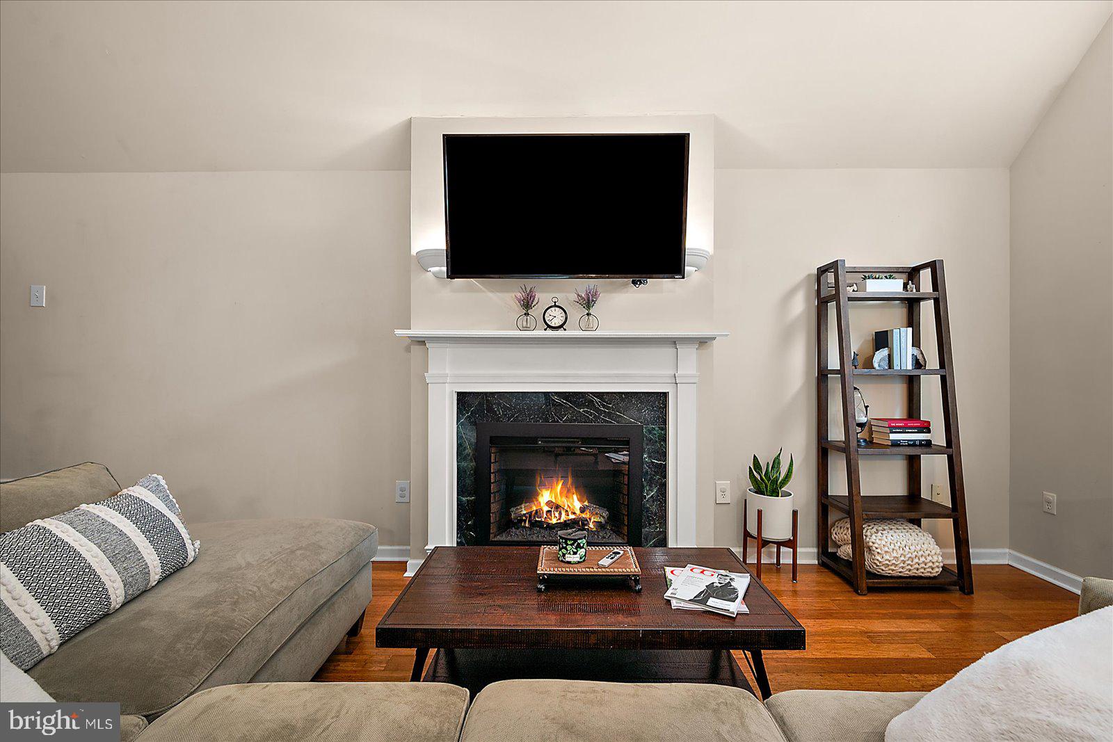 74 Robin Hood Trail Ocean Pines, MD 21811 - Photo 5 of 59 a living room with furniture and a fireplace