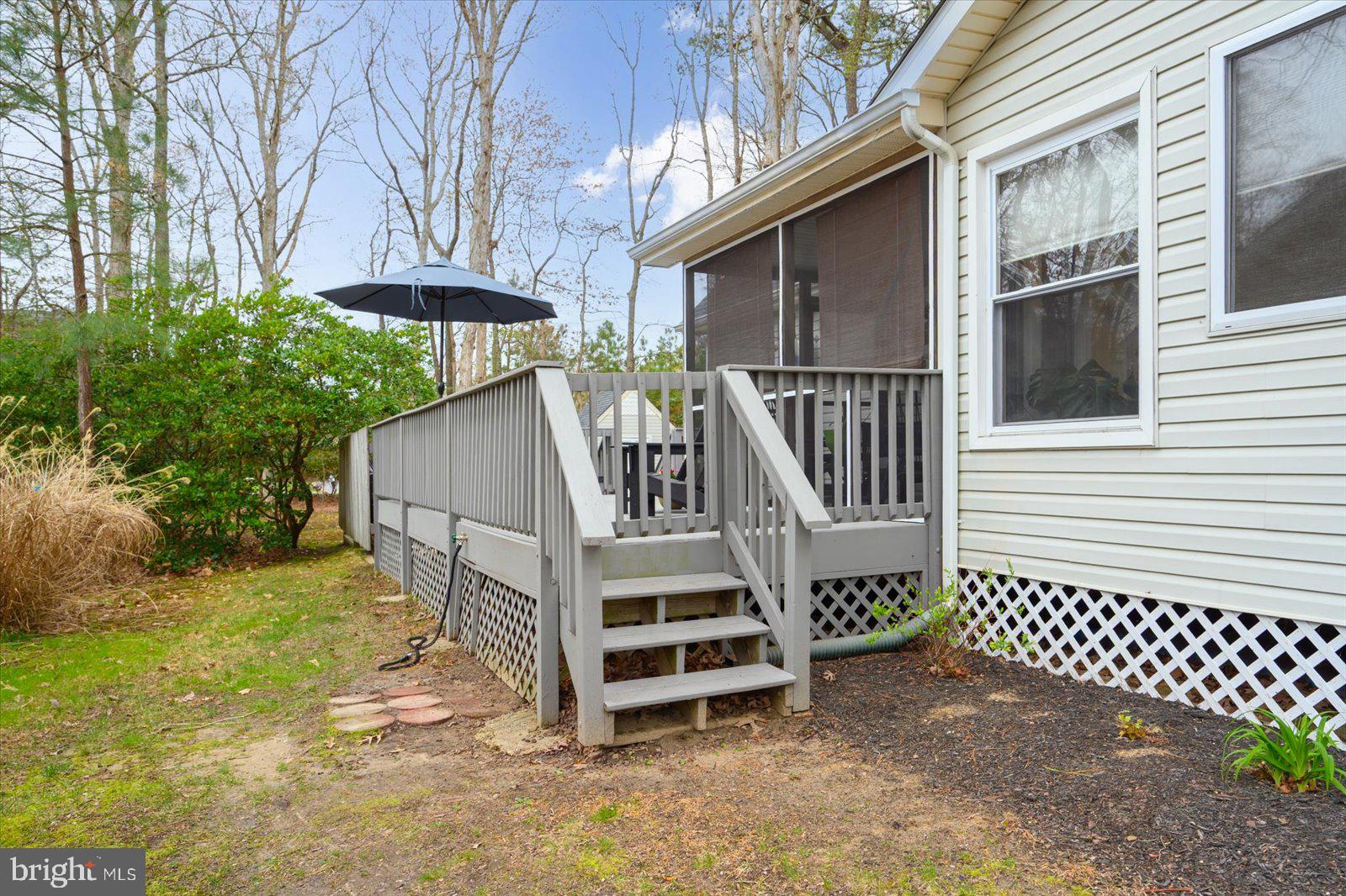 74 Robin Hood Trail Ocean Pines, MD 21811 - Photo 52 of 59 a view of a house with a yard