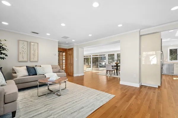 a view of empty room with a fireplace and windows