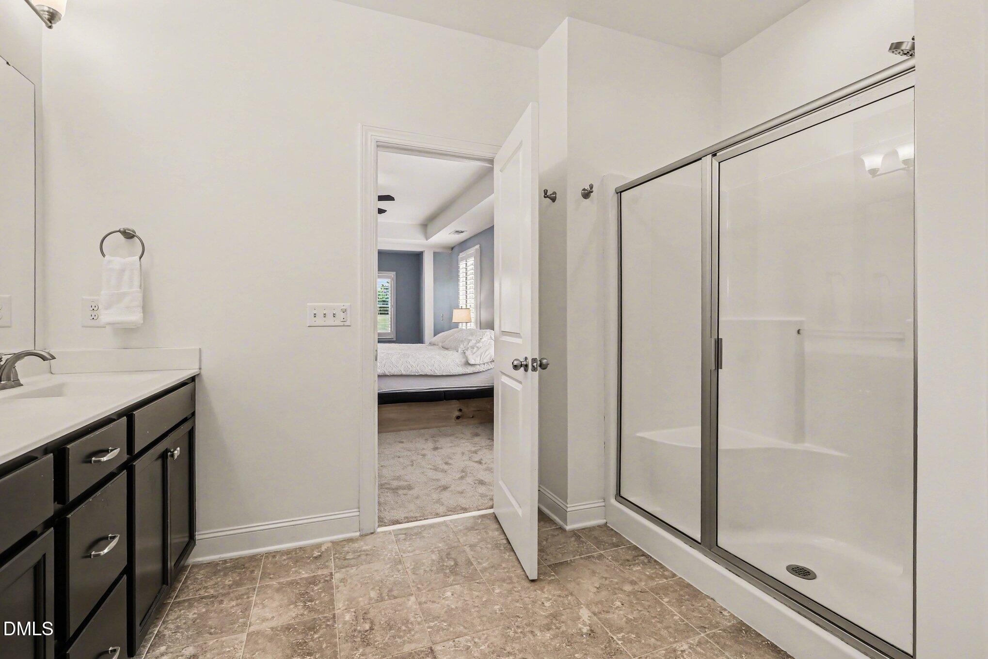 432 Seabring Lane Raleigh, NC 27603 - Photo 22 of 29 a bathroom with a double vanity sink and mirror