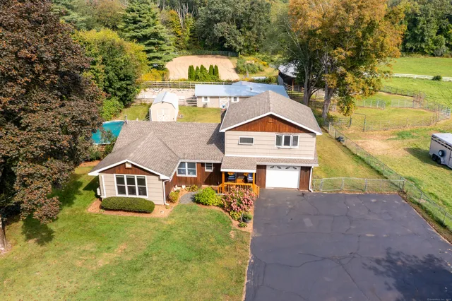 a view of a house with a yard