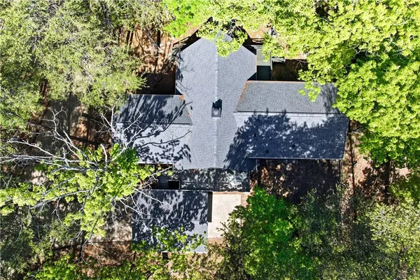 an aerial view of a house with a lake view