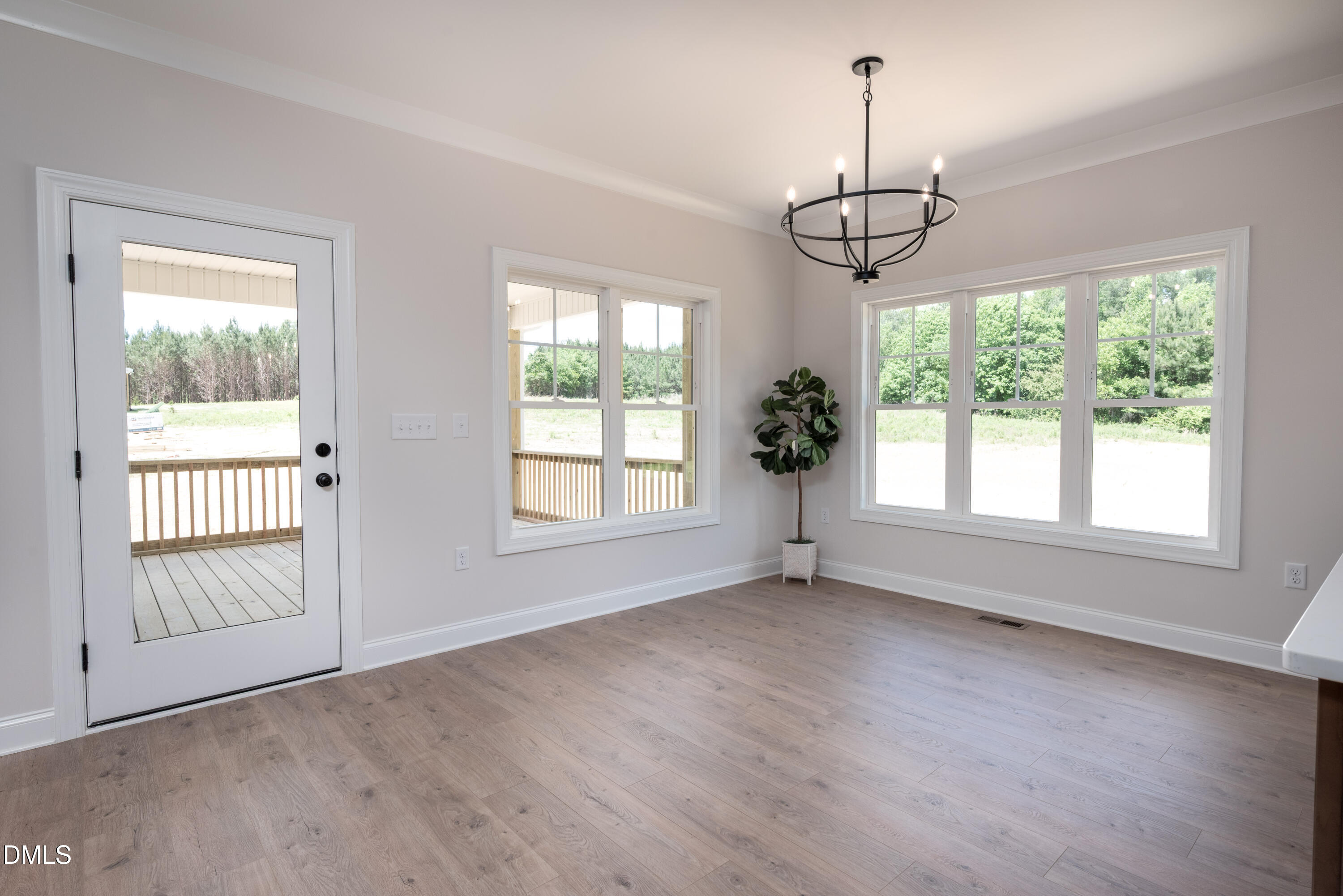 2275 Peachtree Hills Road Spring Hope, NC 27882 - Photo 20 of 43 a view of an empty room with wooden floor and a window