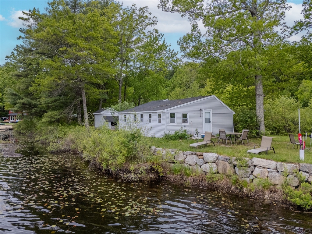 60 Valley Groton Ma Groton, MA 01450 - Photo 2 of 26 a view of a house with a yard and a large tree