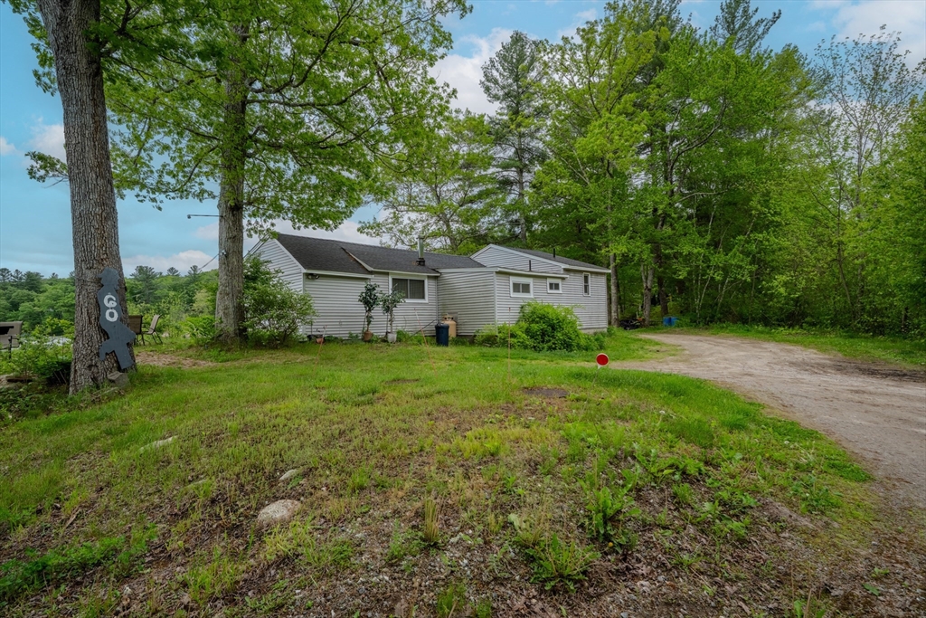 60 Valley Groton Ma Groton, MA 01450 - Photo 24 of 26 a view of a house with backyard and a sitting area