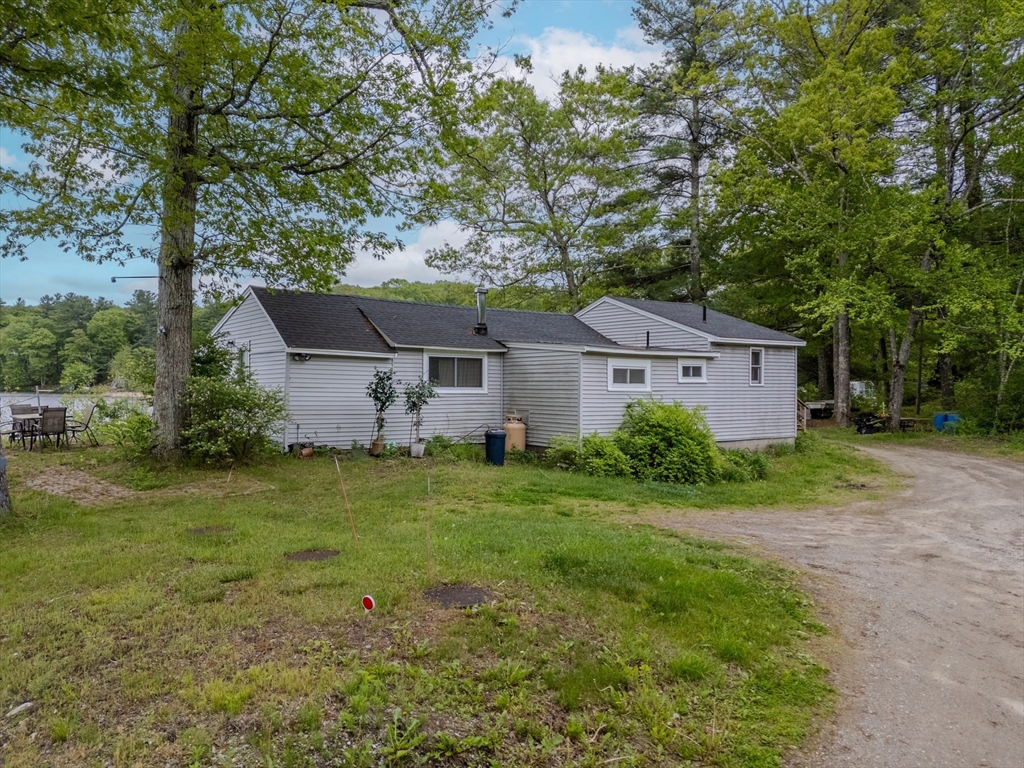 60 Valley Groton Ma Groton, MA 01450 - Photo 3 of 26 a front view of house with yard and trees