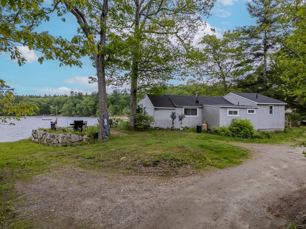 60 Valley Groton Ma Groton, MA 01450 - Photo 4 of 26 a view of a house with backyard and a tree
