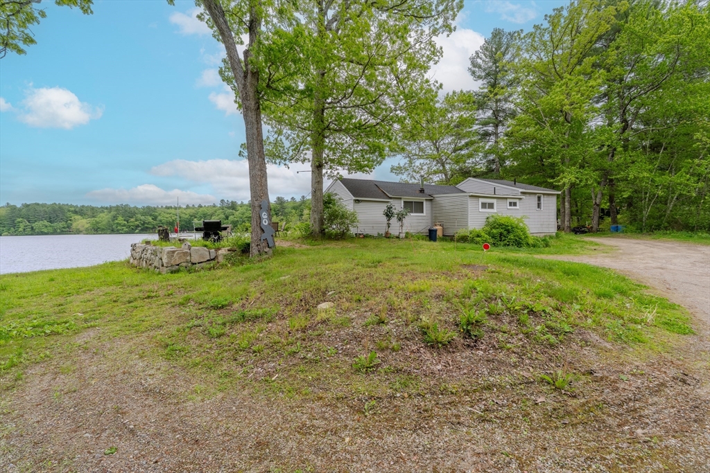 60 Valley Groton Ma Groton, MA 01450 - Photo 7 of 26 a view of a house with yard and a garden