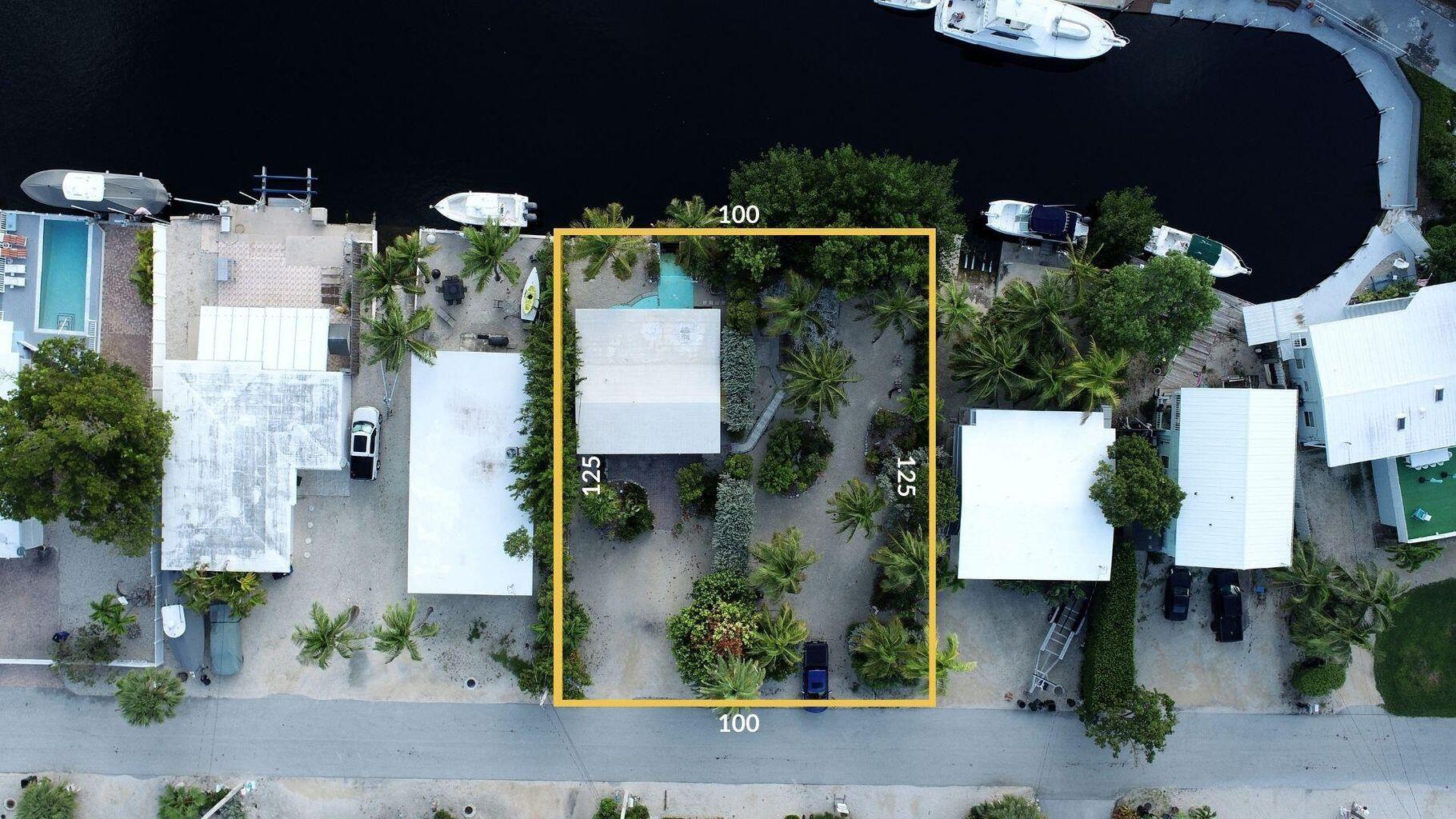 an aerial view of houses with outdoor space