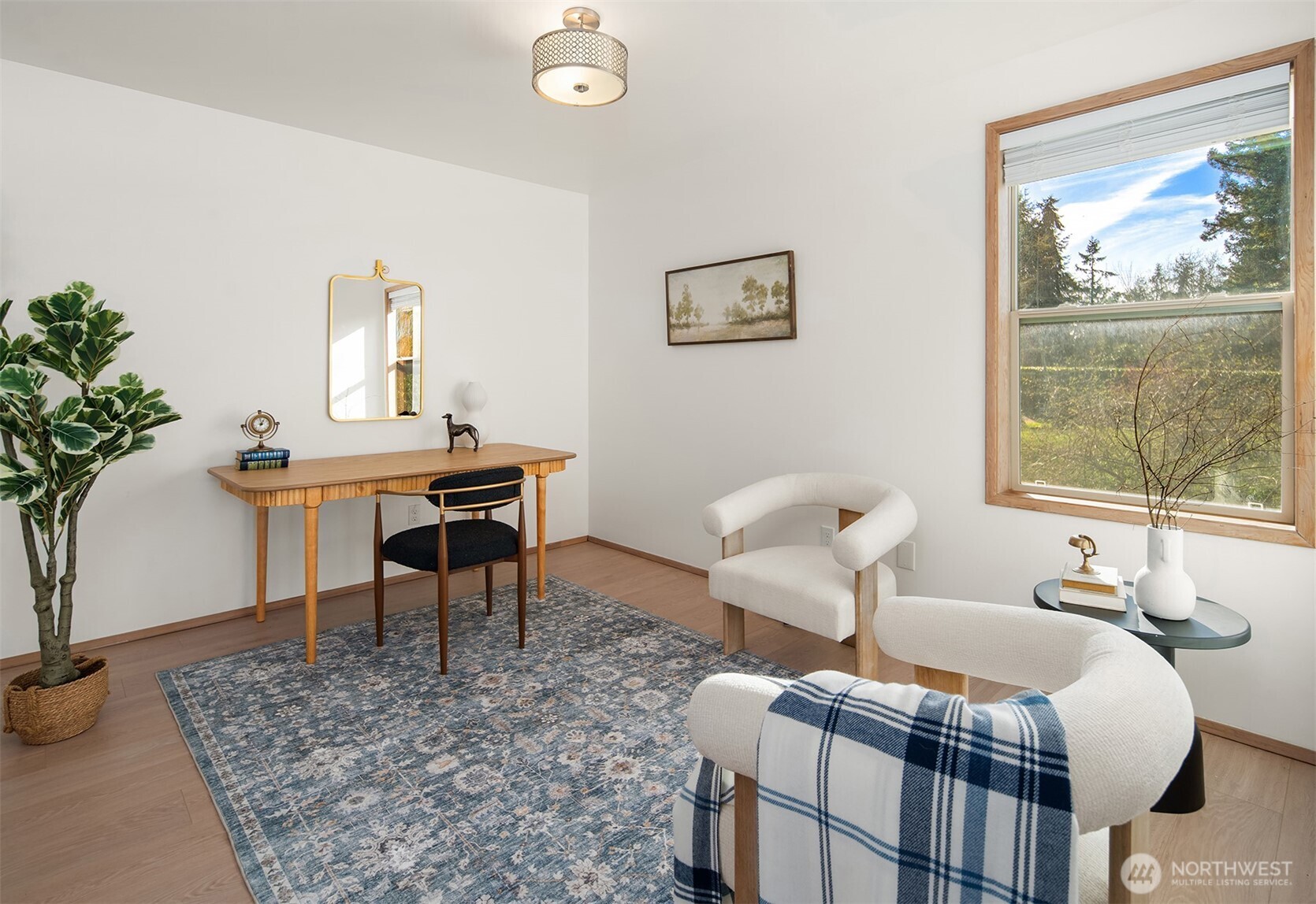 7010 Southwest Maury Park Road Vashon, WA 98070 - Photo 17 of 40 a bedroom with furniture and a window