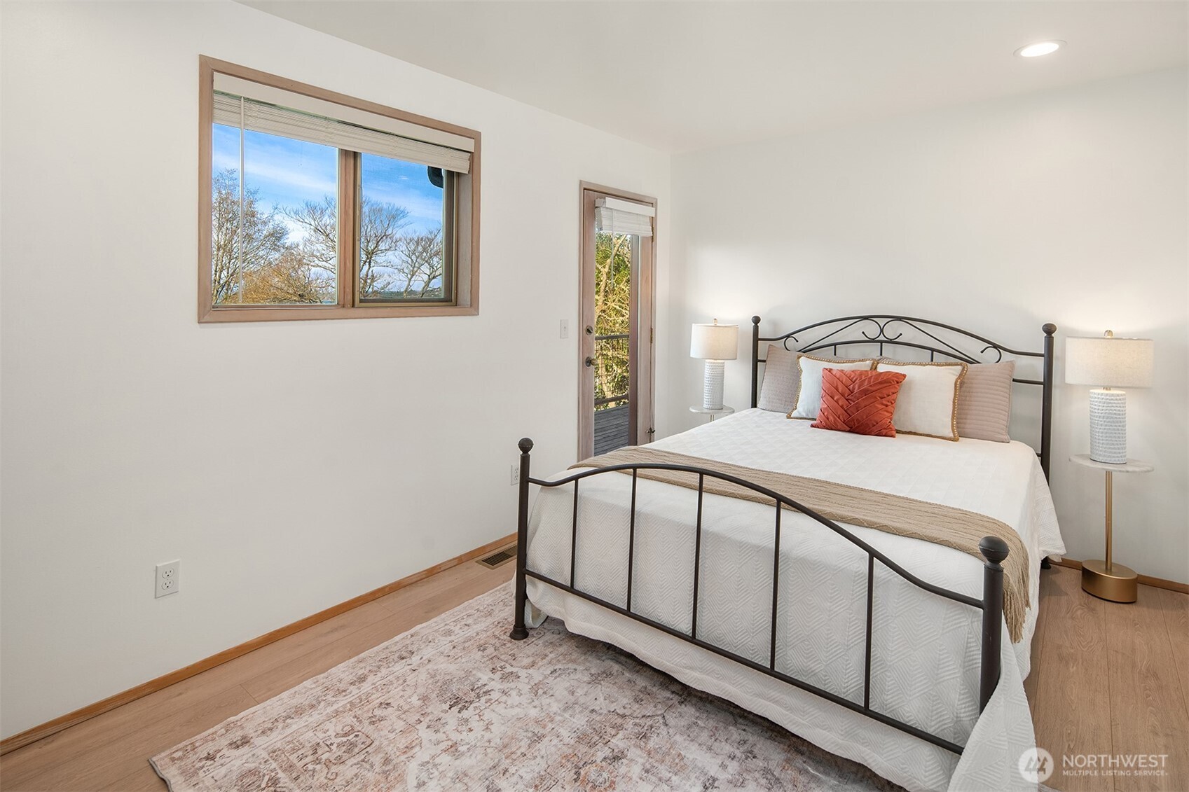 7010 Southwest Maury Park Road Vashon, WA 98070 - Photo 21 of 40 a bedroom with a large bed and a window