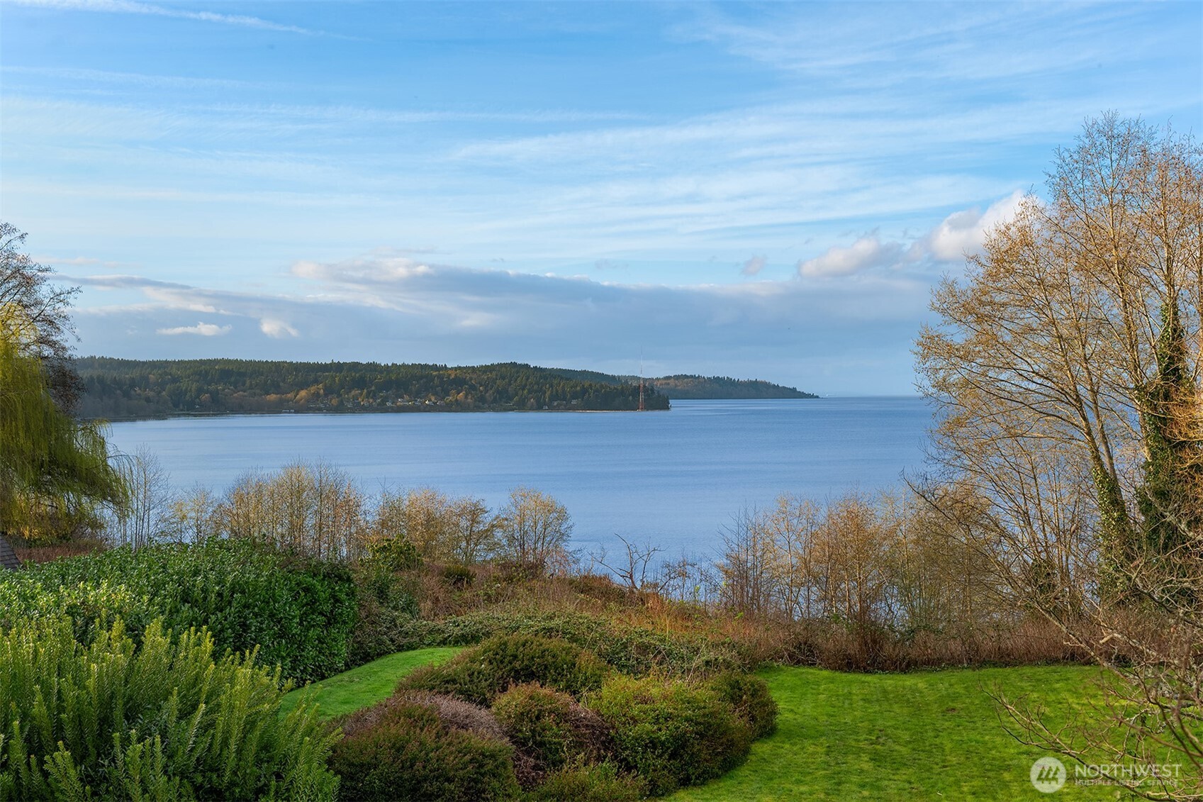 7010 Southwest Maury Park Road Vashon, WA 98070 - Photo 31 of 40 a view of a lake with houses in the back