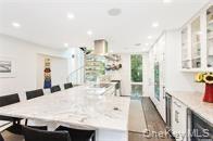 337 Shell Walk Fire Island Pines, NY 11782 - Photo 3 of 7 a large white kitchen with sink and refrigerator