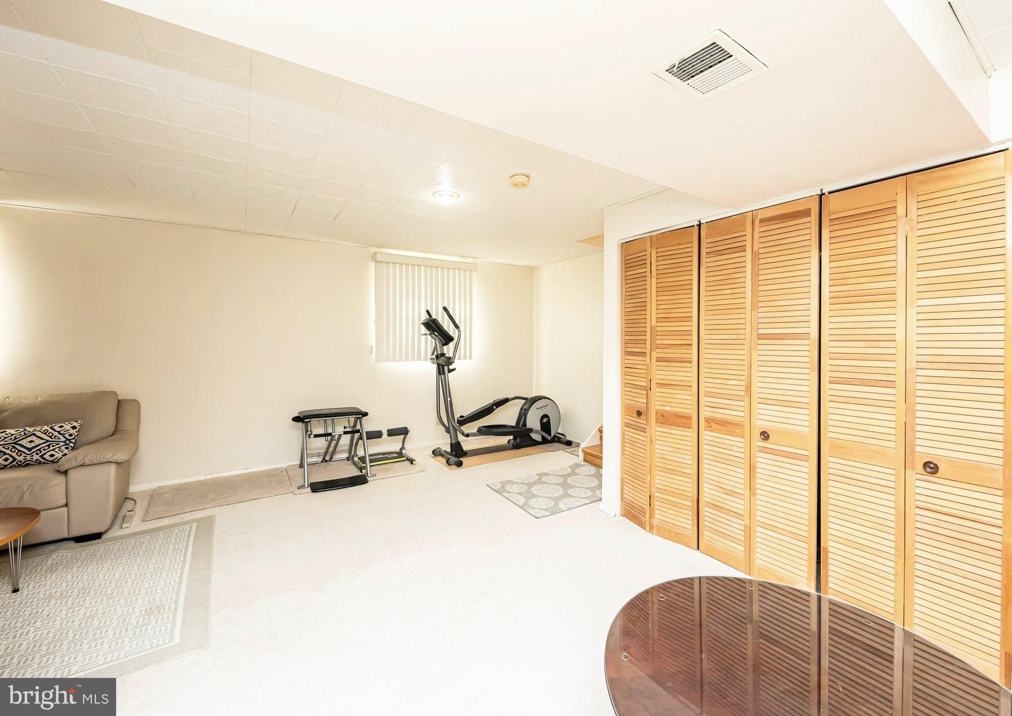 1803 East Beech Road Sterling, VA 20164 - Photo 13 of 38 a bedroom with furniture and a large window