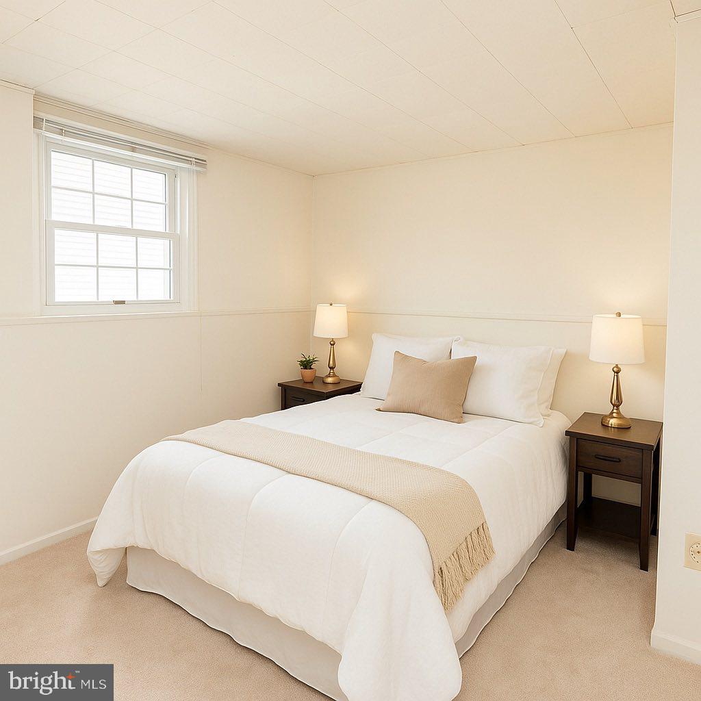 1803 East Beech Road Sterling, VA 20164 - Photo 17 of 38 a bedroom with a bed and a window