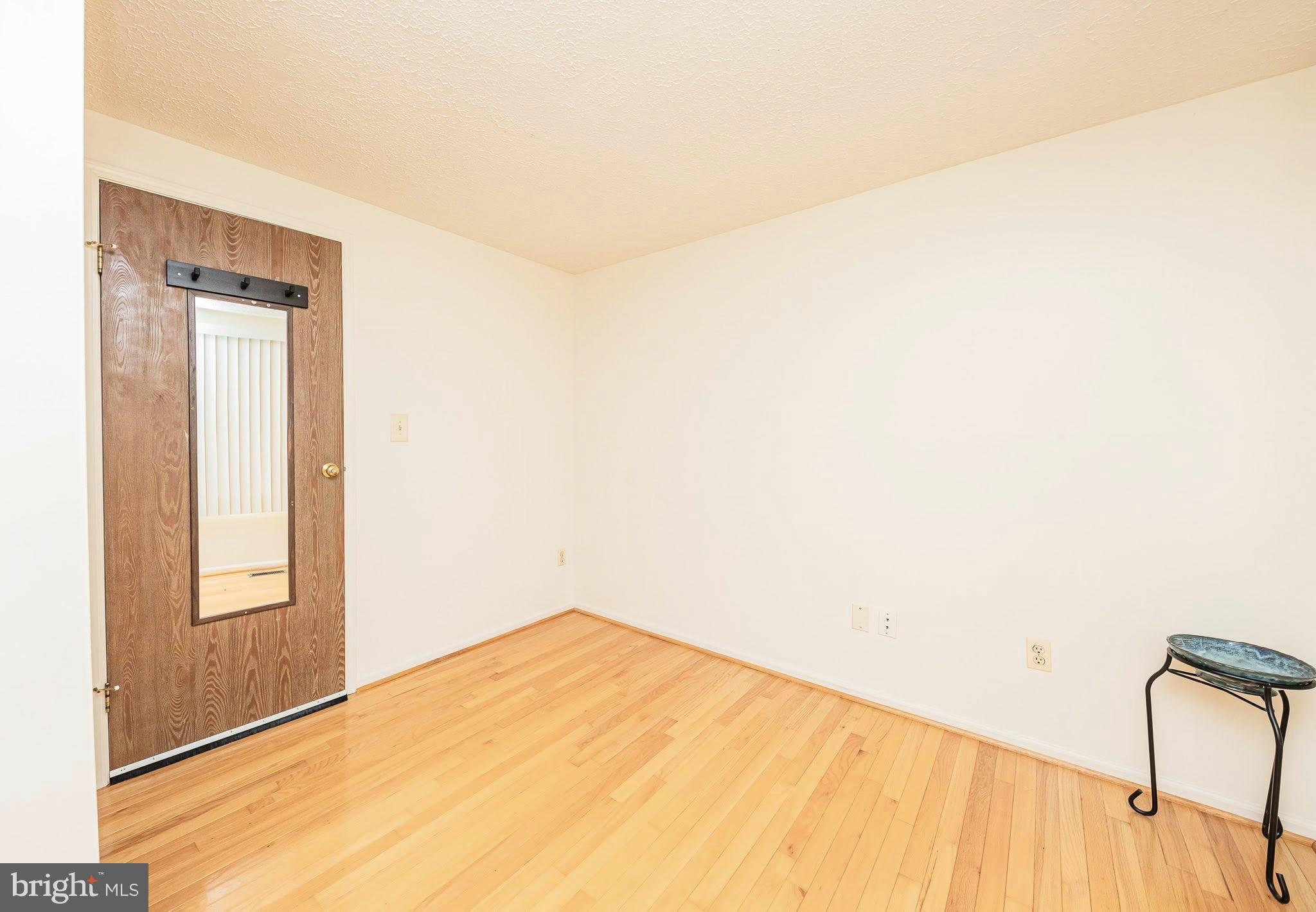 1803 East Beech Road Sterling, VA 20164 - Photo 19 of 38 a view of empty room with wooden floor