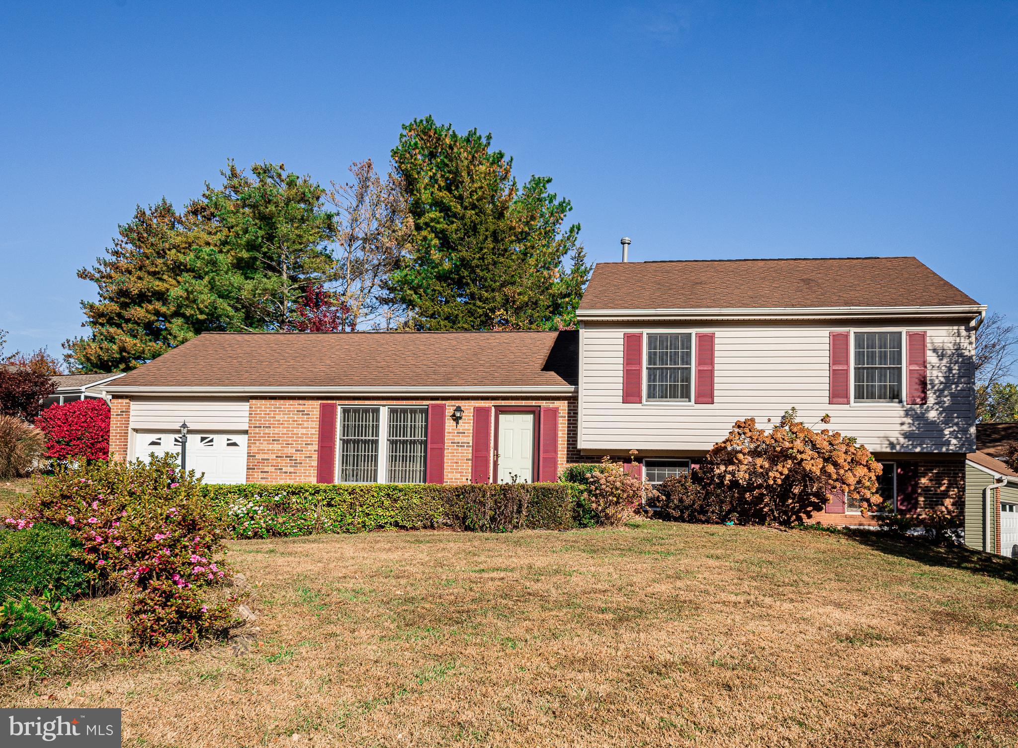 1803 East Beech Road Sterling, VA 20164 - Photo 2 of 38 a front view of a house with a yard