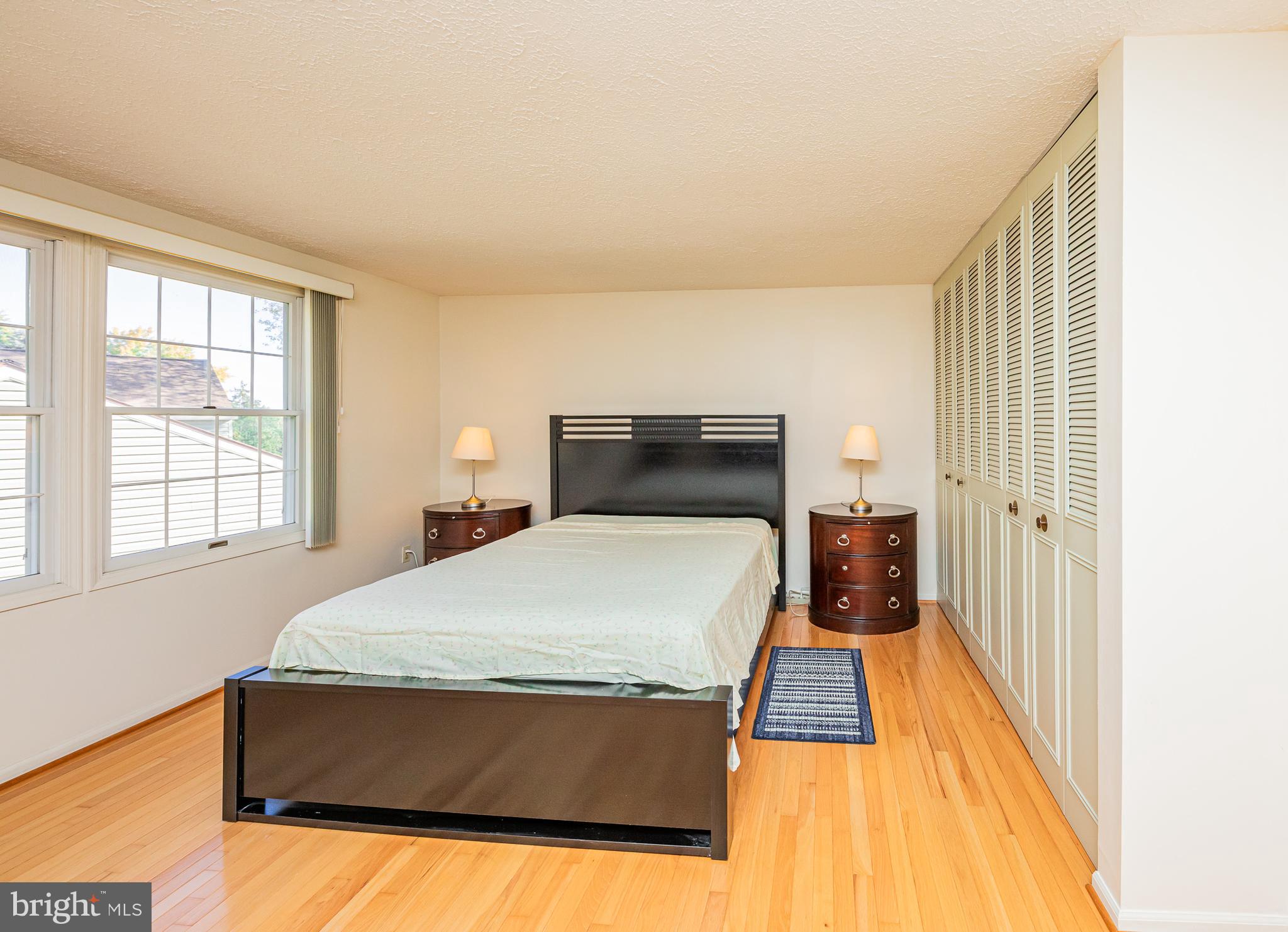1803 East Beech Road Sterling, VA 20164 - Photo 28 of 38 a bed sitting in a bedroom next to a window