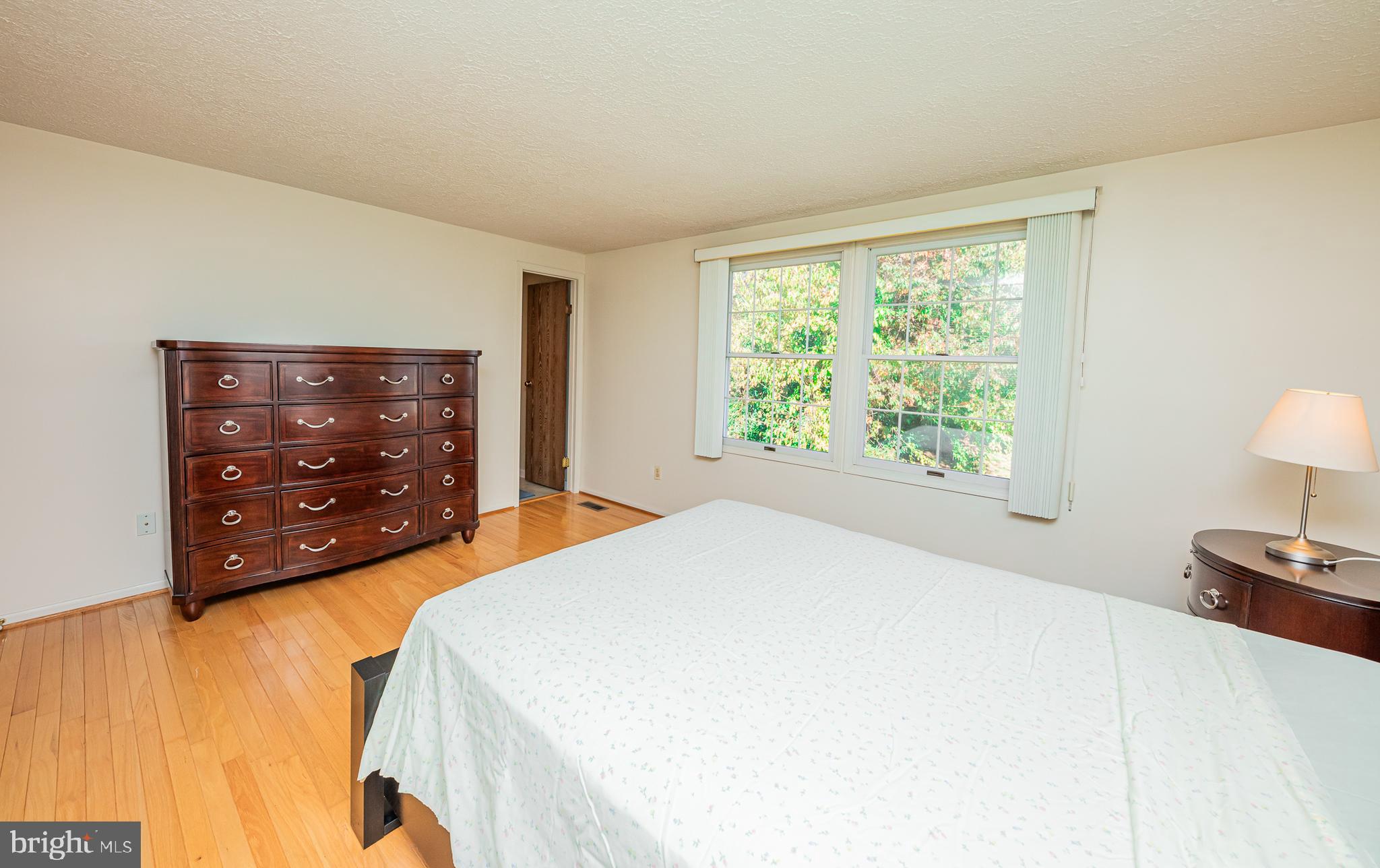1803 East Beech Road Sterling, VA 20164 - Photo 29 of 38 a bedroom with a bed and a tv on table