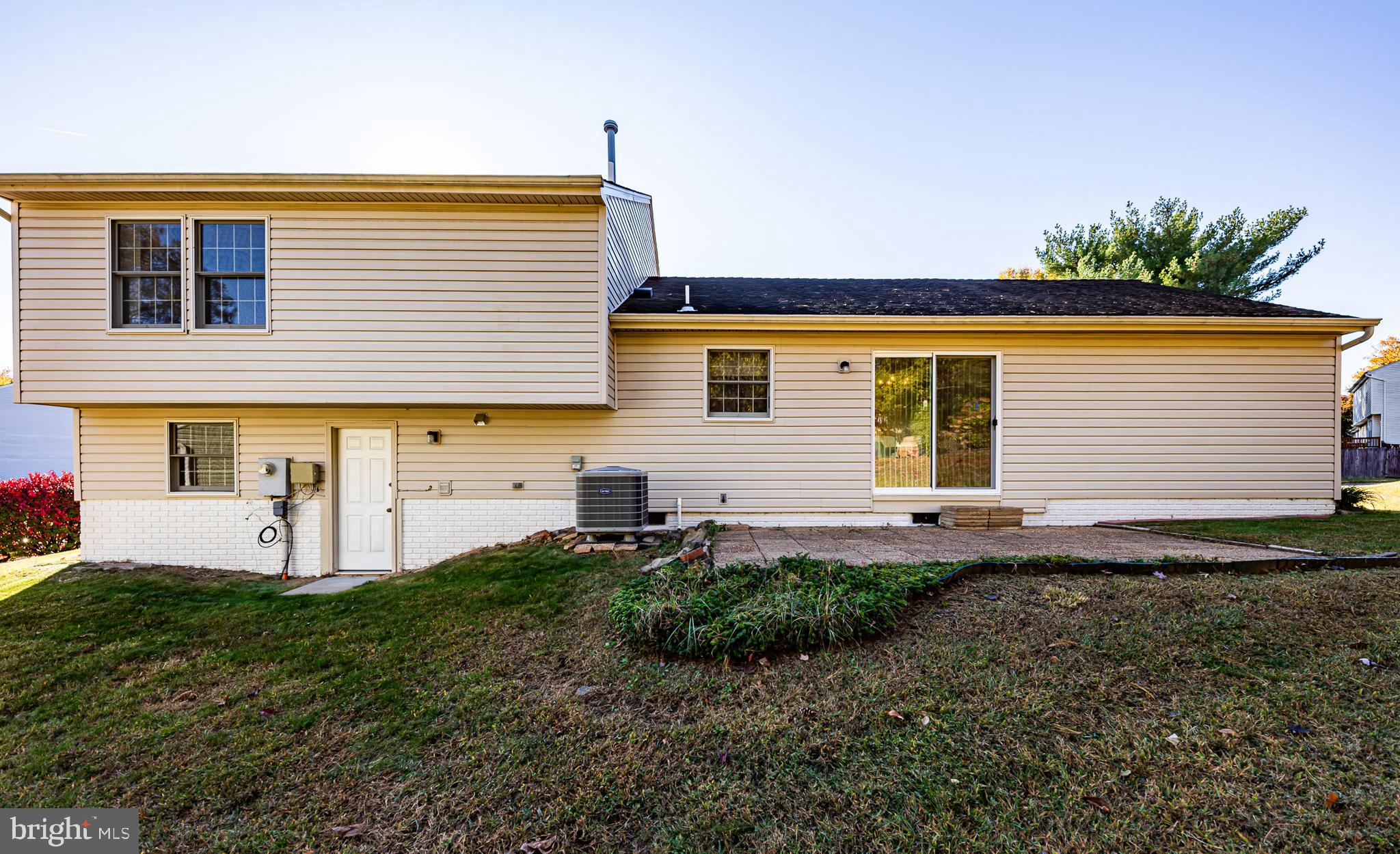 1803 East Beech Road Sterling, VA 20164 - Photo 3 of 38 a front view of a house with garden