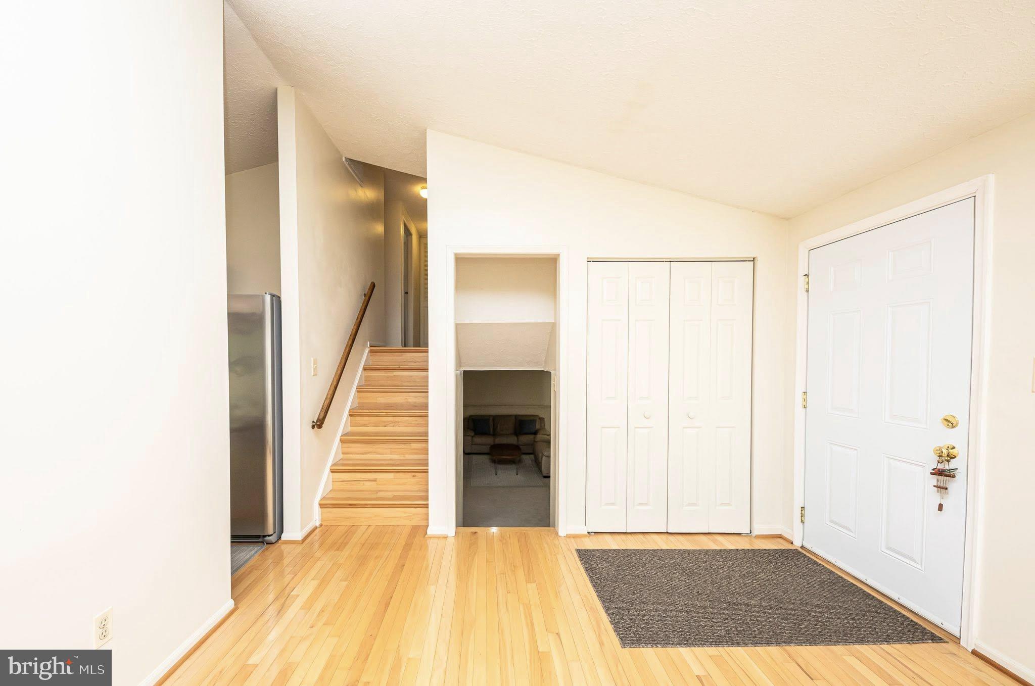 1803 East Beech Road Sterling, VA 20164 - Photo 7 of 38 a view of a room with wooden floor and stairs