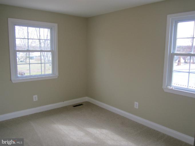 2107 Rolling Rd. Windsor Mill, MD 21244 - Photo 1 of 29 an empty room with a window