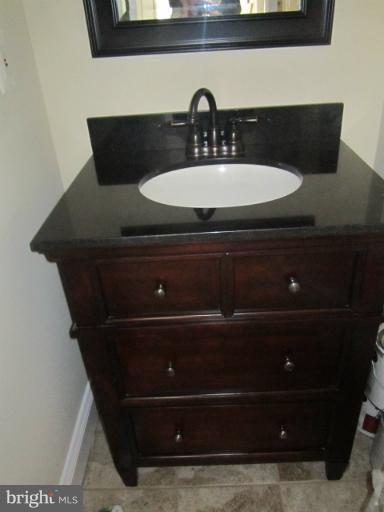 2107 Rolling Rd. Windsor Mill, MD 21244 - Photo 12 of 29 a bathroom with a sink and a mirror